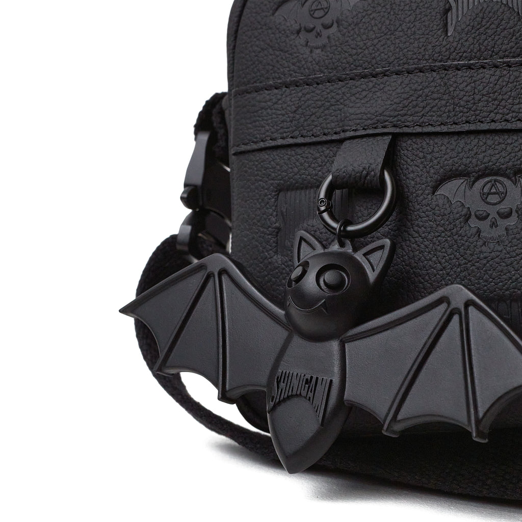 Shinigami Couture black leather bag detail showing Beep the Bat charm