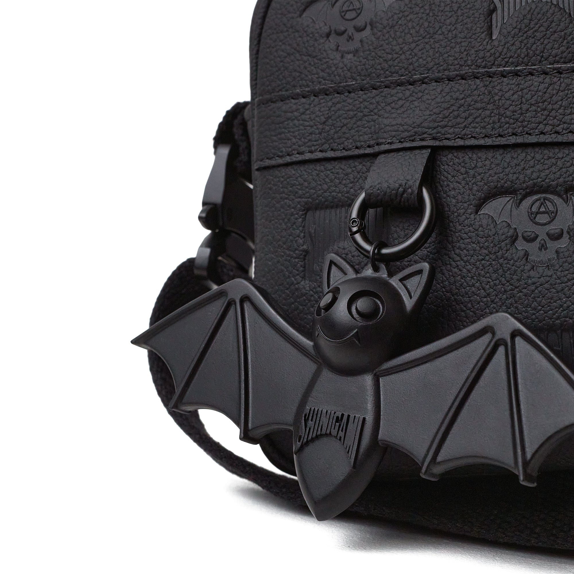 Shinigami Couture black leather bag detail showing Beep the Bat charm