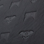 Close-up of Shinigami Couture black embossed leather pattern texture
