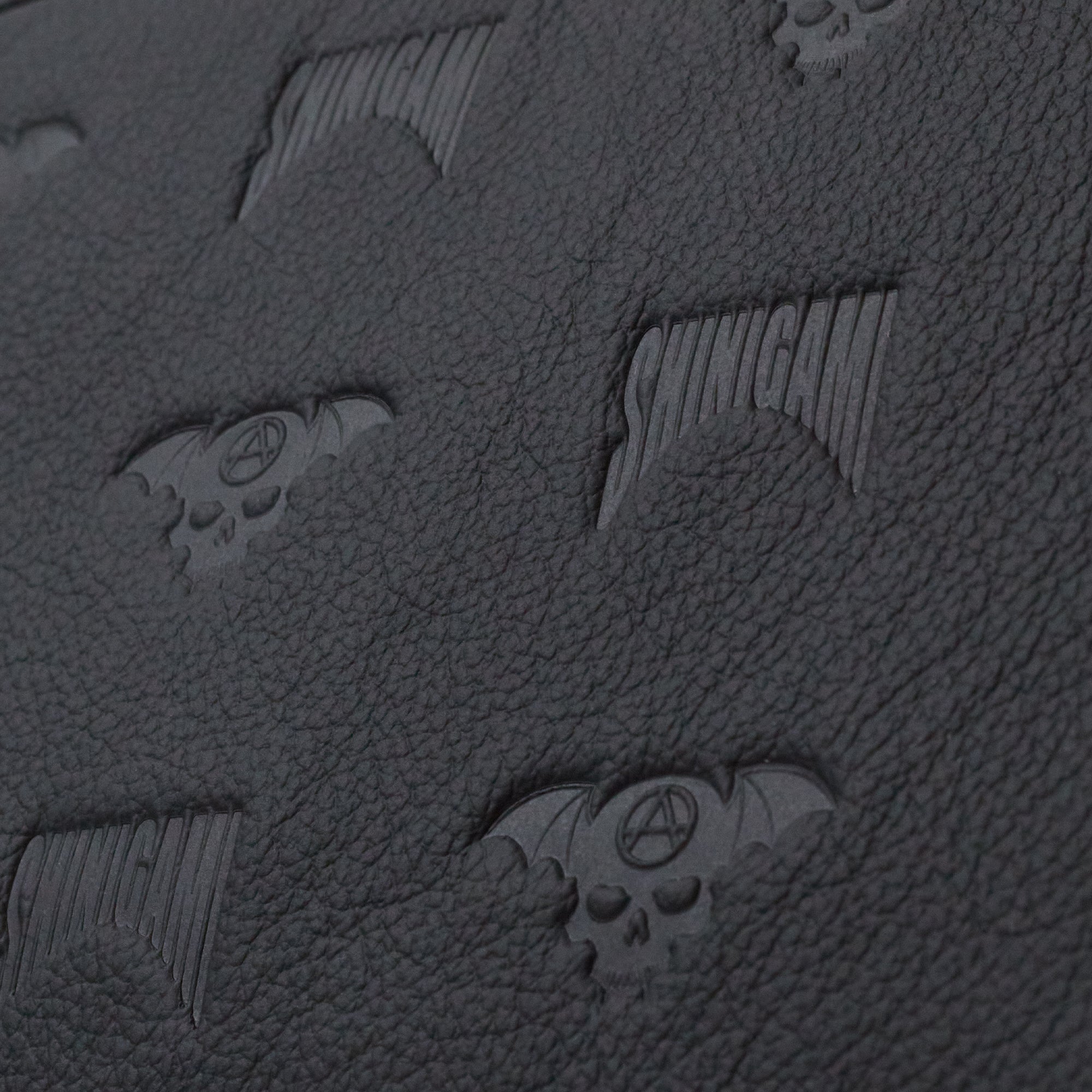 Close-up of Shinigami Couture black embossed leather pattern texture