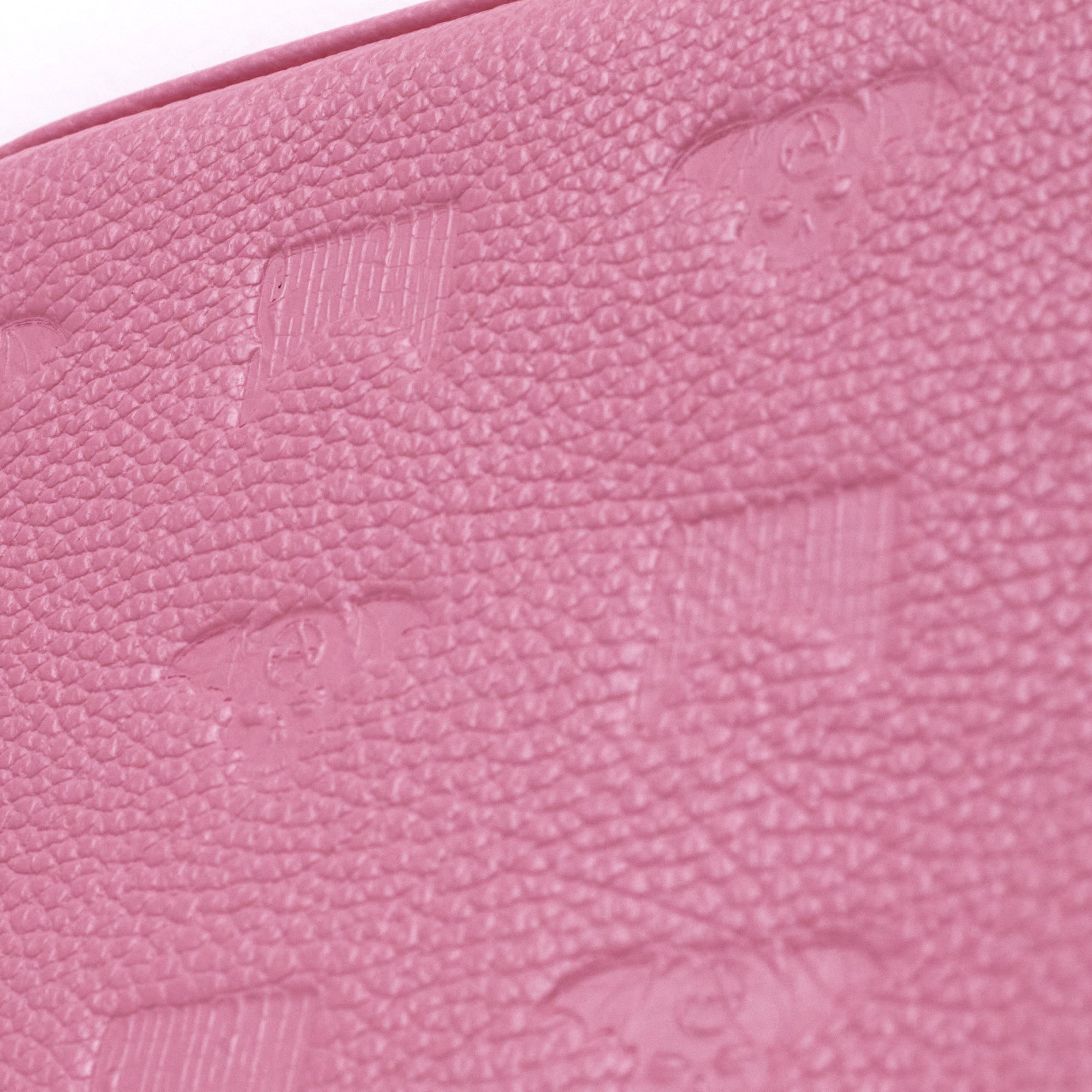 Close-up of Shinigami Couture pink embossed leather pattern texture