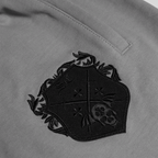 Shinigami Couture light gray shorts chest coat of arms logo embroidery detail