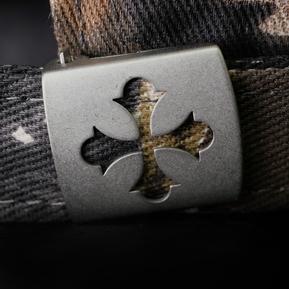Shinigami Couture camouflage cap with cross-shaped metal buckle hardware detail