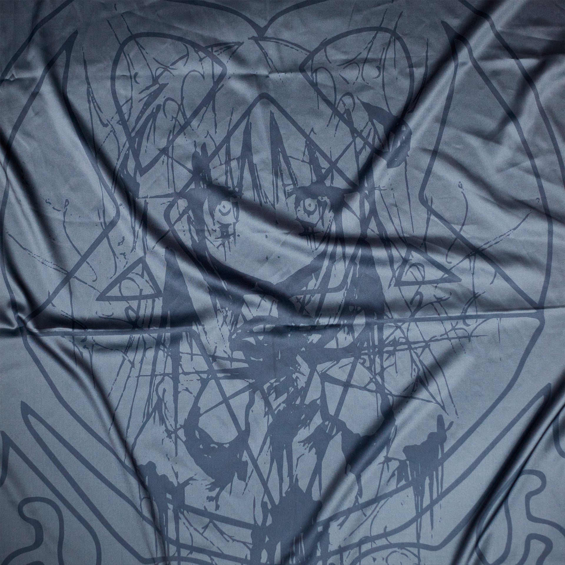 Close-up of Shinigami Couture dark crusader silk shawl folded fabric texture